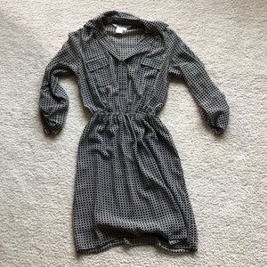 Long sleeved dress with cinched waist.